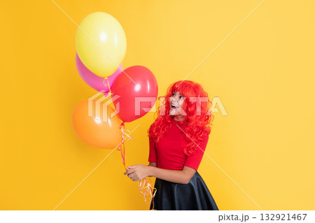 positive child with party balloon on yellow background 132921467