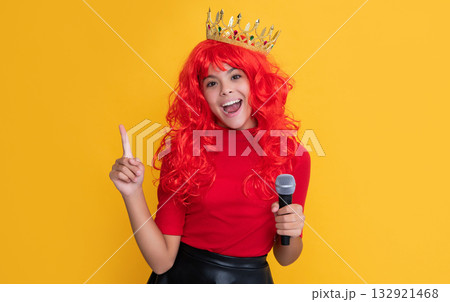 inspired with idea kid in crown with microphone on yellow background inspired with idea kid in crown with microphone on yellow background 132921468