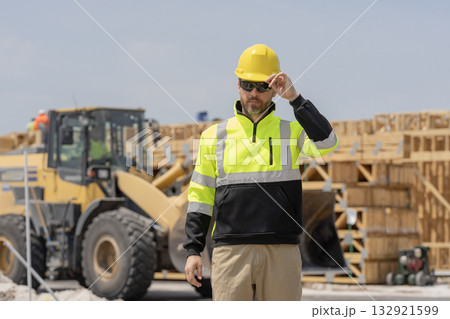 Industry construction worker. Builder civil engineer at building. Supervisor engineer. Worker at construction site. Builder construction man. Worker supervisor heavy machinery. Safety inspection 132921599