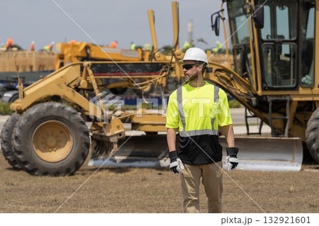 Supervisor at object. Worker at construction site. Builder construction man. Worker supervisor heavy machinery. Safety inspection. Industry construction worker. Builder civil engineer at building Supervisor at object. Worker at construction site. Builder construction man. Worker supervisor heavy machinery. Safety inspection. Industry construction worker. Builder civil engineer at building 132921601