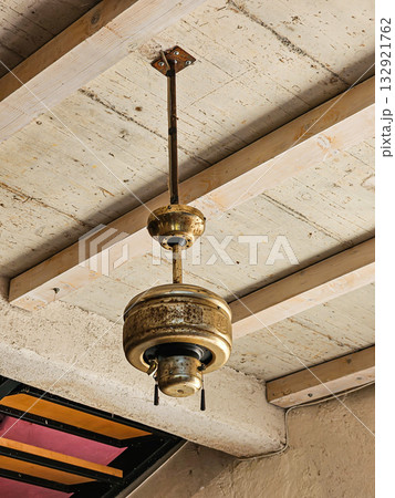 Old iron lamp on ceiling 132921762