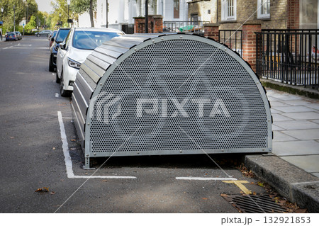 Urban Bicycle Storage Unit on City Street. Urban infrastructure, transportation design and secure 132921853