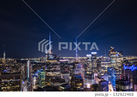 Night cityscape of Midtown Manhattan with illuminated skyscrapers and bright skyline lights 132922468