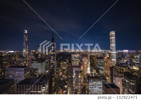Night panoramic view of Midtown Manhattan with illuminated skyscrapers and Central Park in the distance Night panoramic view of Midtown Manhattan with illuminated skyscrapers and Central Park in the distance 132922471