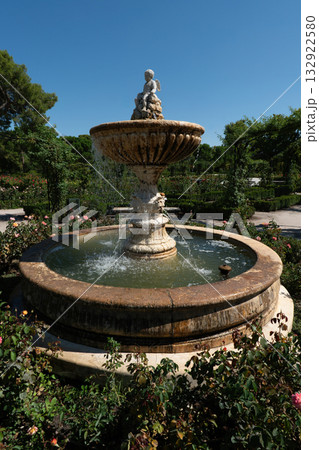 Stone Fountain with Cupid Statue in Madrids Rose Garden, Spain 132922580