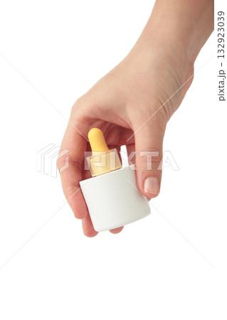 Beauty cosmetic skincare oil in bottle isolated on white background. Elegant mockup for skincare, serum, or beauty branding presentations. 132923039