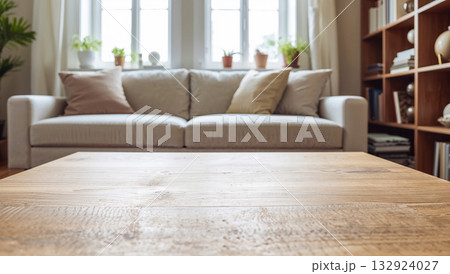 Cozy living room with a wooden coffee table and a comfortable sofa 132924027