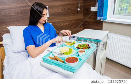 Tray with breakfast for the young female patient. Tray with breakfast for the young female patient. 132925794