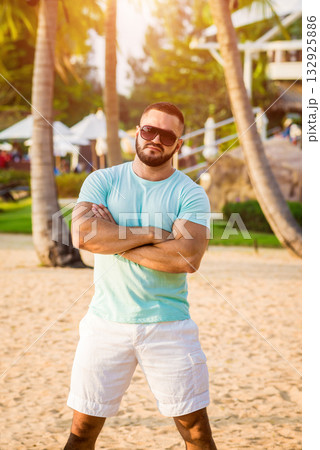 Young man on a tropical beach. Summer 132925886