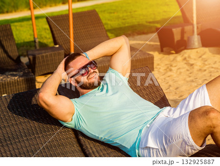 Young man on a tropical beach. Summer Young man on a tropical beach. Summer 132925887