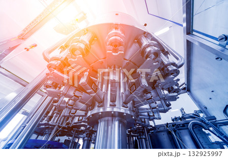 Bottling line of sunflower oil in bottles. Vegetable oil production plant.  132925997