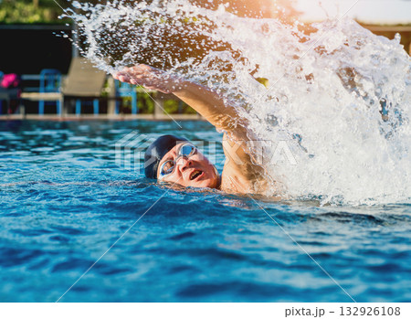 Young athletic man swimming in the swimming pool Young athletic man swimming in the swimming pool 132926108