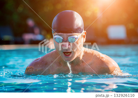 Young athletic man swimming in the swimming pool Young athletic man swimming in the swimming pool 132926110