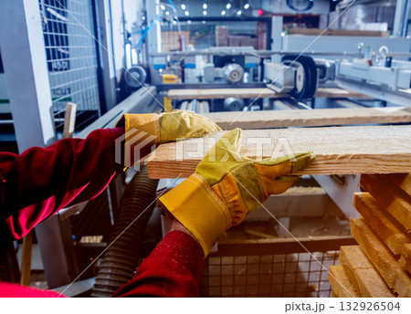 Carpenter with fibreboards at furniture factory workshop. Woodworking industry 132926504