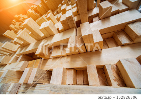 Stack of natural rough wooden boards. Wooden boards, lumber, industrial wood. 132926506