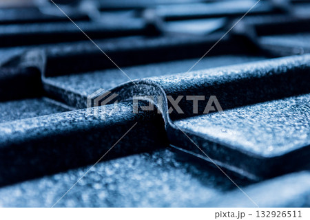 Blue metallic roof tiles background with drops of water. 132926511