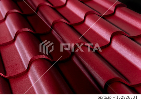 Red metallic roof tiles background with drops of water. 132926531