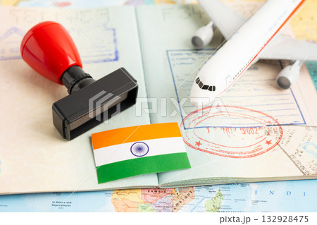 Approved Stamp visa and passport with India flag document to immigration at airport in country. Approved Stamp visa and passport with India flag document to immigration at airport in country. 132928475