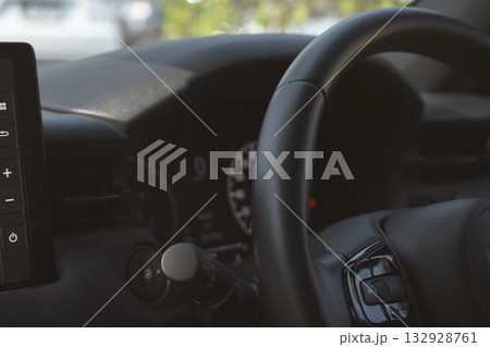 interior view of car with black leather, steering wheel with button interior view of car with black leather, steering wheel with button 132928761