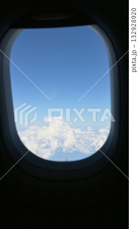 Scenery outside the window of a passenger plane, beautiful blue sky and white cloud view Scenery outside the window of a passenger plane, beautiful blue sky and white cloud view 132928920