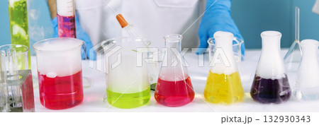 Banner Science chemistry glass tubes object on lab background. Wide Liquid tube biology laboratory chemical fluid scientist object medical glass tubes. Chemistry scientific background with Copy Space Banner Science chemistry glass tubes object on lab background. Wide Liquid tube biology laboratory chemical fluid scientist object medical glass tubes. Chemistry scientific background with Copy Space 132930343