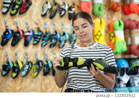 Girl choose summer shoes for hiking 132932912