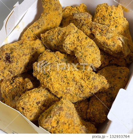 Crispy fried chicken with golden, crunchy skin and juicy, tender meat. A delicious and savory dish, perfect for any meal, served with dipping sauces or side dishes for extra flavor! 132933764