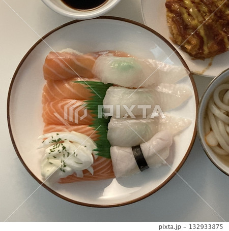 An assortment of fresh sushi, artfully arranged with a variety of toppings and vibrant colors. This traditional Japanese dish combines vinegared rice, seafood, and vegetables for an experience. 132933875