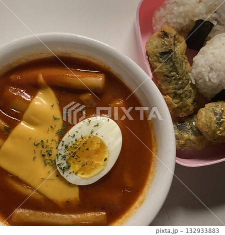 Spicy tteokbokki with chewy rice cakes in a rich, flavorful sauce, paired with crispy twigim for the perfect Korean street food combo. A delicious mix of spicy, crunchy, and savory flavors! Spicy tteokbokki with chewy rice cakes in a rich, flavorful sauce, paired with crispy twigim for the perfect Korean street food combo. A delicious mix of spicy, crunchy, and savory flavors! 132933883