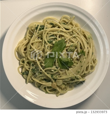 Spaghetti salad combines al dente pasta with fresh vegetables, tangy dressing, and optional herbs or cheese. A vibrant, refreshing dish perfect for light meals or gatherings. 132933973