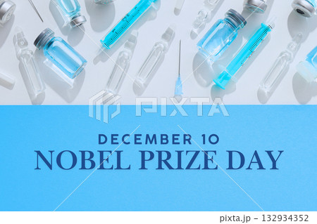 Decorative layout of syringes and vials on blue Decorative layout of syringes and vials on blue 132934352