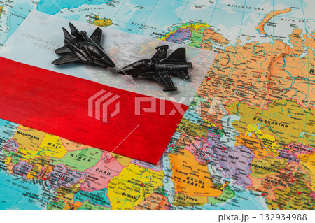 Poland flag and model jets on a world map showcasing aviation pride 132934988