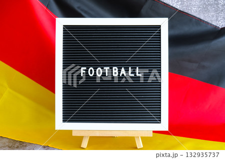 Lightbox with text STUDY IN GERMAN National symbol of Germany. German wave silky flag background. Education and learning  132935737