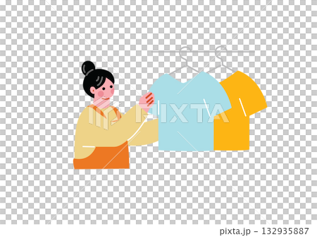 A woman hanging up the laundry A woman hanging up the laundry 132935887