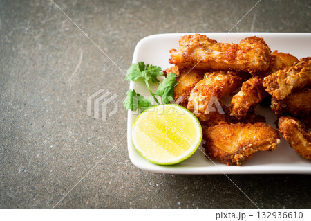 Fried Snapper Belly on white plate 132936610