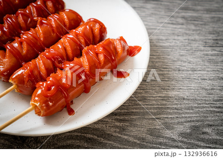 fried sausage skewer with ketchup 132936616