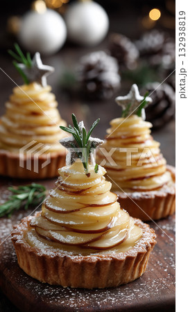 Festive dessert display with layered apple tarts shaped like Christmas trees Festive dessert display with layered apple tarts shaped like Christmas trees 132938819