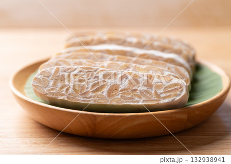 Tempeh (fermented soybeans), Traditional Indonesian food, Healthy vegan and plant based ingredients Tempeh (fermented soybeans), Traditional Indonesian food, Healthy vegan and plant based ingredients 132938941