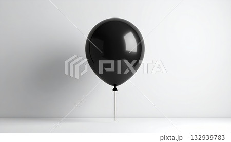 Single black and white balloon with a pop of red, perfect for a happy birthday party celebration decoration Single black and white balloon with a pop of red, perfect for a happy birthday party celebration decoration 132939783