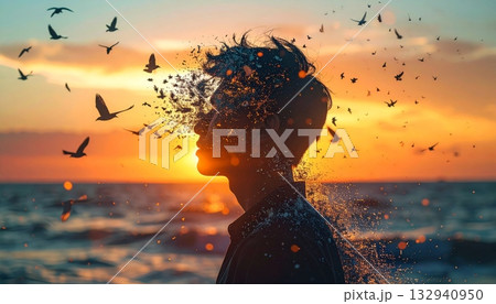 Tropical summer sunset on the beach creates a stunning silhouette of a girl against the orange and red sky, ocean, and water 132940950