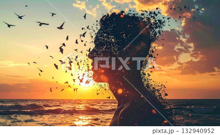 Tropical summer sunset on the beach creates a stunning silhouette of a girl against the orange and red sky, ocean, and water Tropical summer sunset on the beach creates a stunning silhouette of a girl against the orange and red sky, ocean, and water 132940952