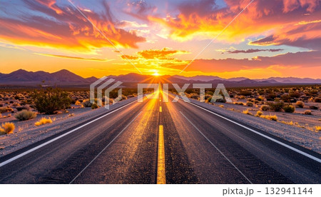 Empty desert highway stretches toward the fiery sunset horizon, symbolizing freedom and the long journey ahead beneath the vibrant sky Empty desert highway stretches toward the fiery sunset horizon, symbolizing freedom and the long journey ahead beneath the vibrant sky 132941144