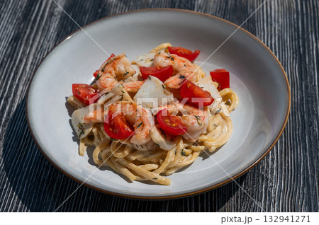 Pasta with shrimp and tomatoes. Pasta with shrimp and tomatoes. 132941271