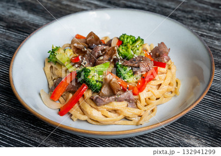 Top view of pasta with beef and broccoli.  132941299