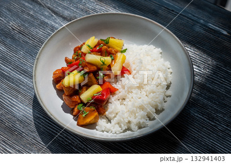 Chicken with pineapple in teriyaki sauce with fried rice. Chicken with pineapple in teriyaki sauce with fried rice. 132941403