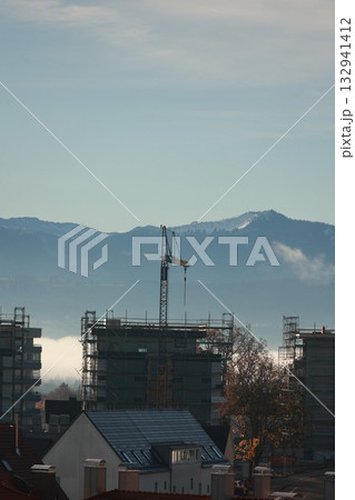 Construction site with snowy mountains backdrop 132941412