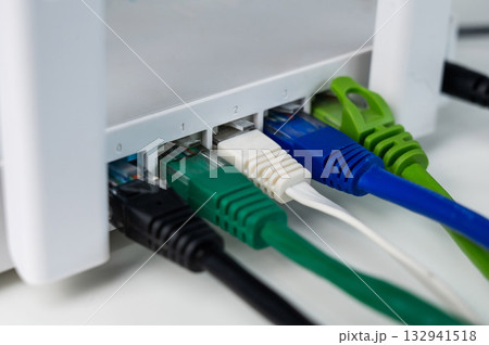 Colorful Ethernet Cables Connected to a Router. Colorful Ethernet Cables Connected to a Router. 132941518