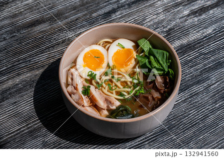 Ramen soup in cafe on wooden table.  132941560
