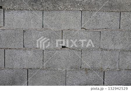 Textured concrete wall featuring weathered blocks in Albania illustrating urban architecture and construction techniques 132942529