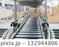 packing line in a logistics warehouse. conveyor belt in a modern production line 132944806